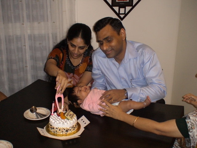 Appa Amma cutting the cake on my behalf!