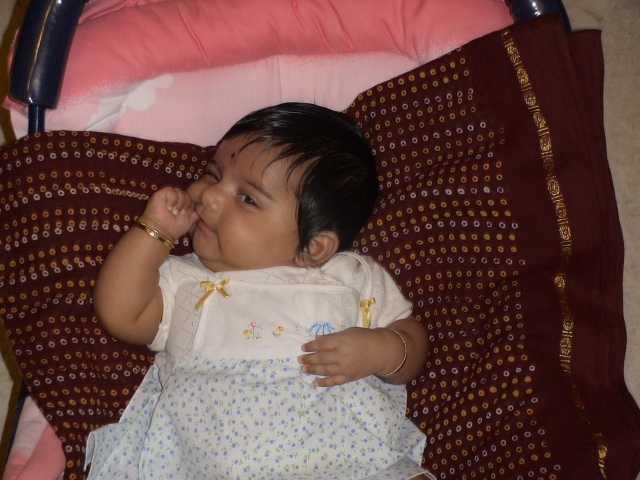 Trying hard to get the finger into the mouth!